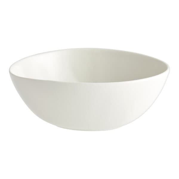 An Acopa Nova cream white stoneware bowl with a small rim on a white background.