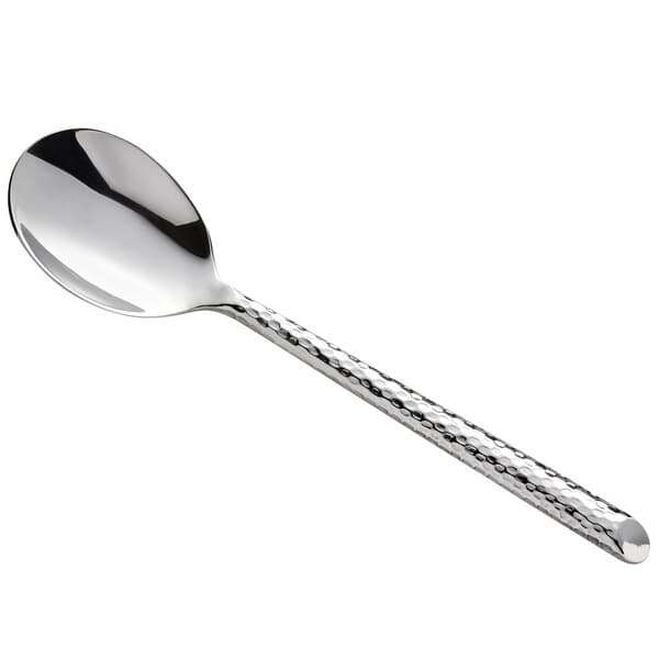 a silver spoon with a textured handle