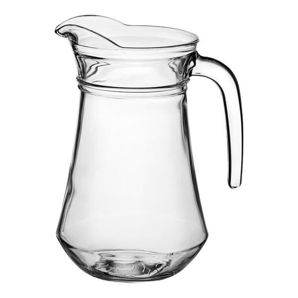 A clear glass Acopa pitcher with a handle.