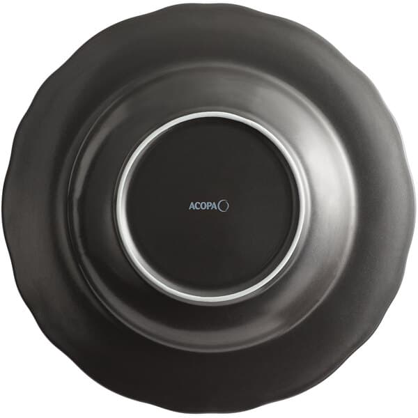 An Acopa Armor Gray porcelain pasta bowl with a scalloped rim in matte black with a silver edge.