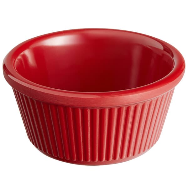 A red fluted Acopa melamine ramekin.