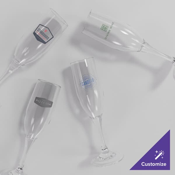 A group of Acopa Endure Tritan plastic champagne flutes with a logo on one glass.
