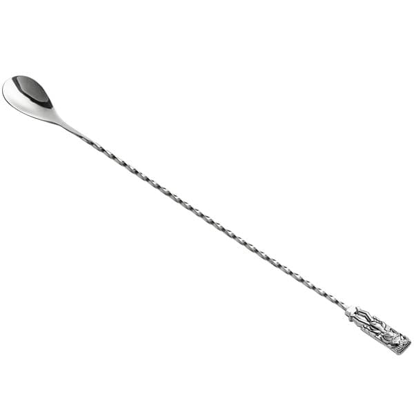 An Acopa silver bar spoon with a tiki end.