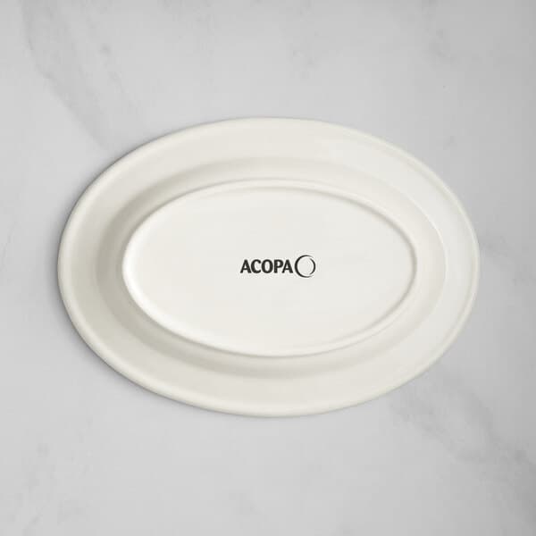 An ivory oval platter with blue bands and black text that reads "Acopa" on it.