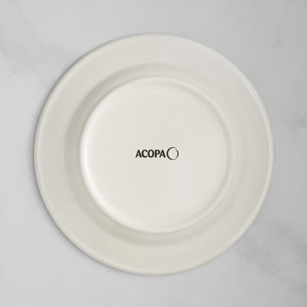 An Acopa ivory stoneware plate with blue bands and black text reading "Acopa" on the rim.