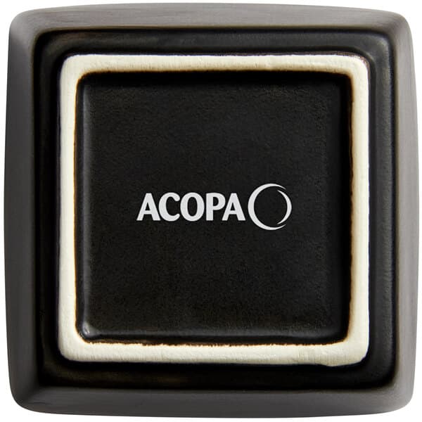 A black square Acopa stoneware sauce cup with white trim.