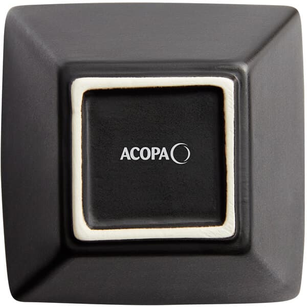 A black square stoneware bowl with a white border.