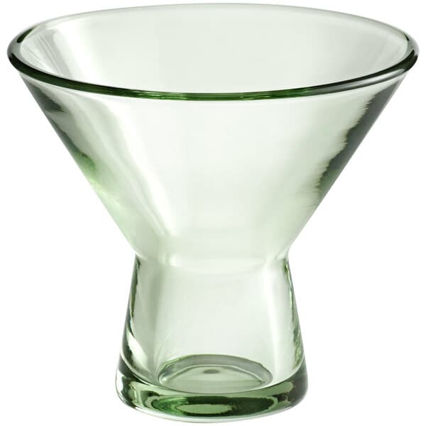 An Acopa Pangea green martini glass with a clear bottom and green rim.