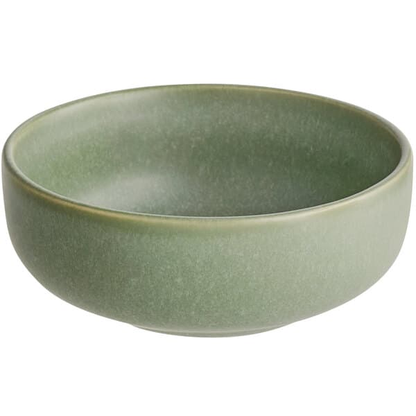 a green bowl with a white background