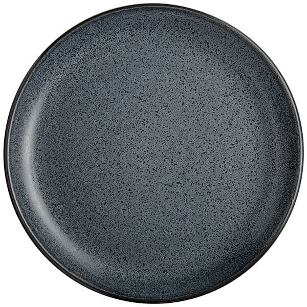 A close up of a midnight blue matte coupe plate with speckles.