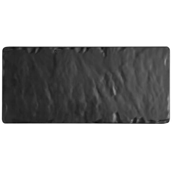 An Acopa faux slate melamine footed serving board with a black rectangular surface.