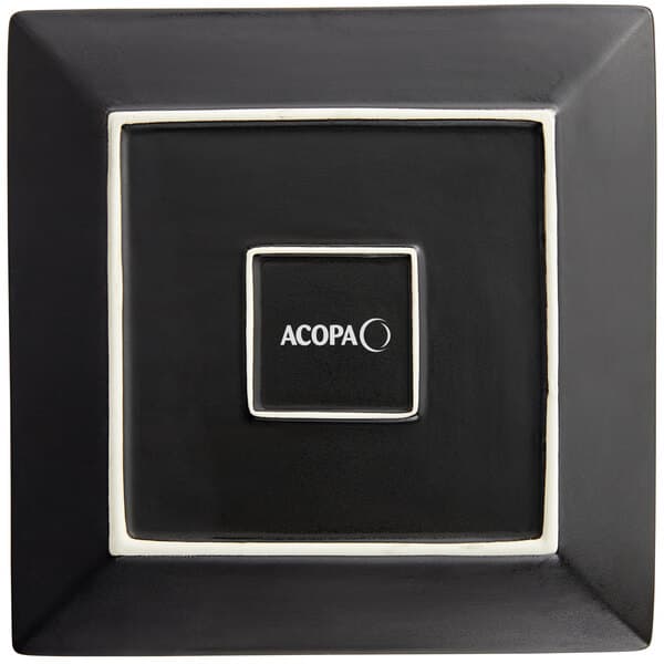 A black square Acopa stoneware plate with white trim and text.