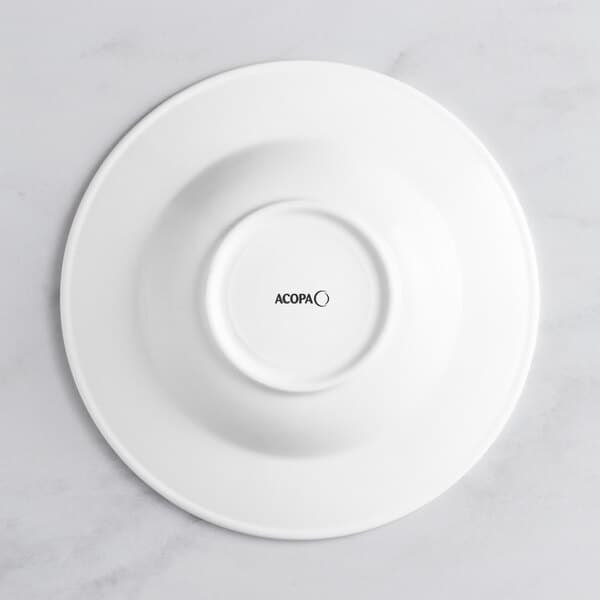 An Acopa Cordelia bright white porcelain bowl with an embossed circle on the rim.