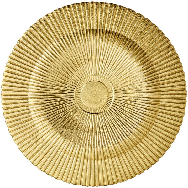 An Acopa sunburst glass charger plate with a gold circular design.