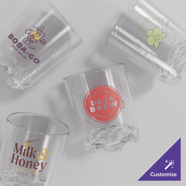 An Acopa Endure customizable Tritan plastic rocks glass with a logo on it.