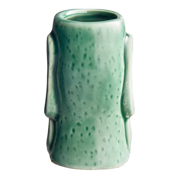 An Acopa green ceramic tiki mug with a handle.