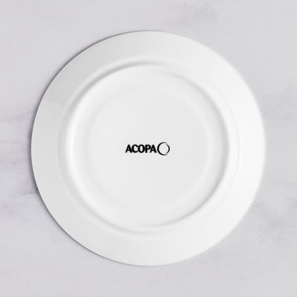 A white Acopa porcelain saucer with black text that says "aco"