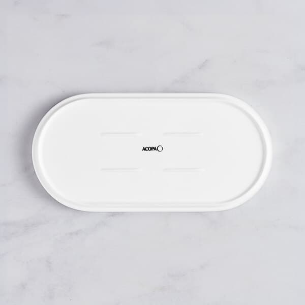 A white oval Acopa Lore porcelain platter with a raised rim and black text on the bottom.