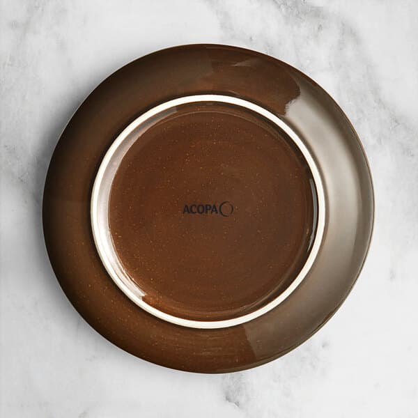 An Acopa Highlands brown china plate with a white rim.