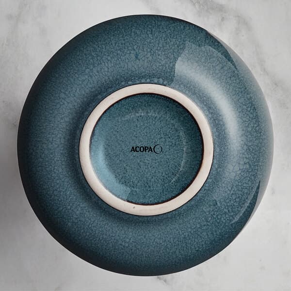 A blue and white ceramic Acopa Highlands sauce cup.