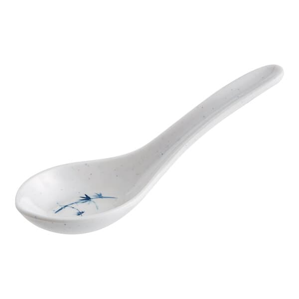 A white spoon with a blue and white speckled design.
