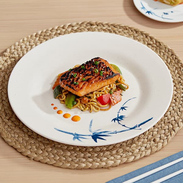 A Biru melamine plate with food on a table.