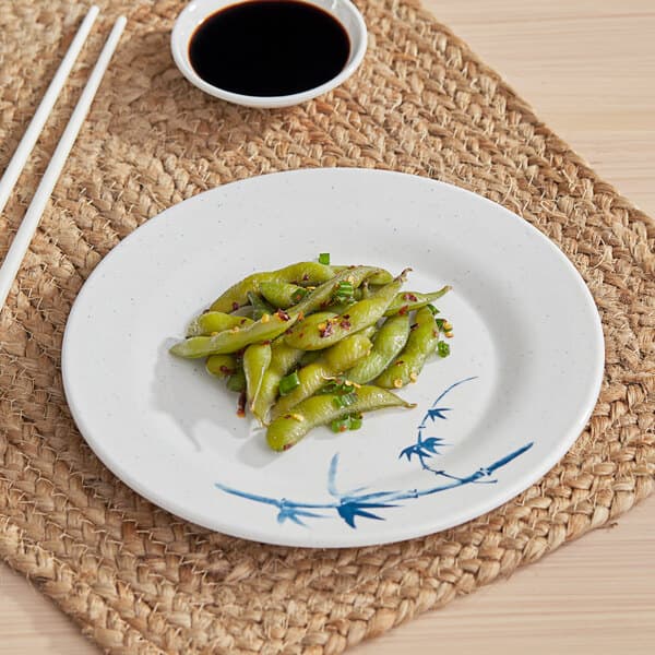 An Acopa Biru melamine plate with green beans.