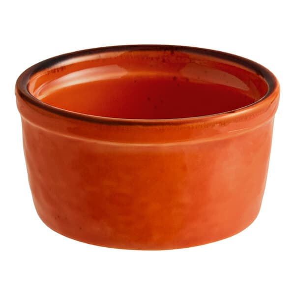 A small orange porcelain ramekin.