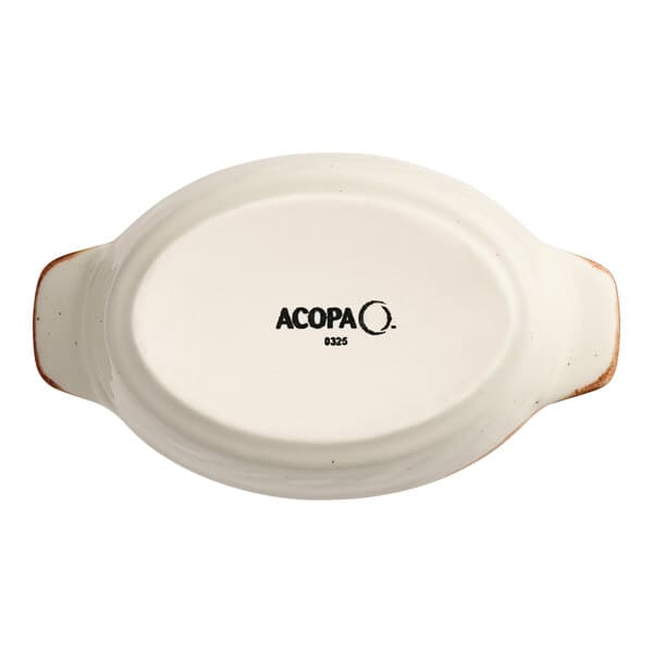 An Acopa white porcelain oval dish with black text reading "Acopa Keystone" on the bottom.