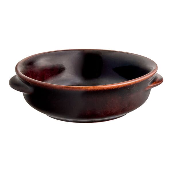 A close up of a brown Acopa Keystone porcelain onion soup bowl with handles.