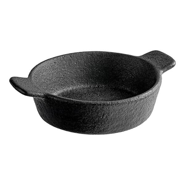 A black round bowl with two white handles.