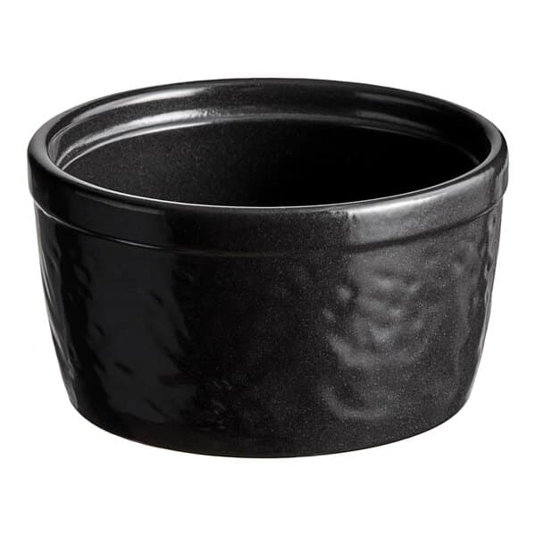 A black Acopa Keystone porcelain ramekin with a textured surface.