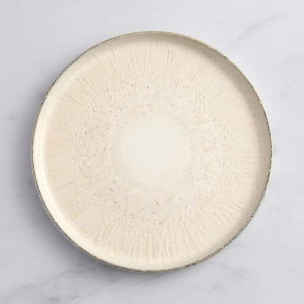 An Acopa Cape gray porcelain plate with a circular design on it.