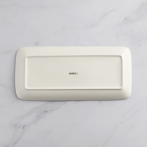 A rectangular gray porcelain platter on a marble surface.