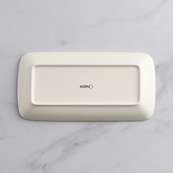 An Acopa Architect rectangular gray porcelain platter on a marble surface.