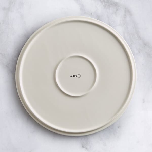A white Acopa Cape porcelain plate with a circular design on it.