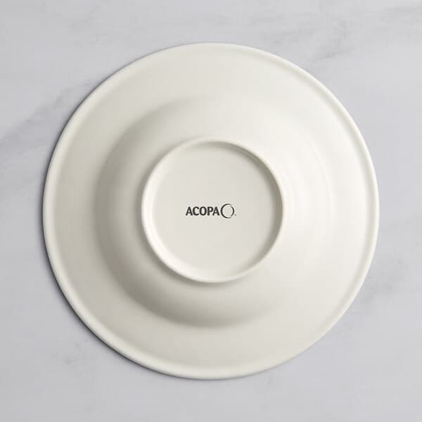A white porcelain bowl with a black circle in the middle and black text that says "Acopa Architect"