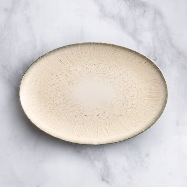 An Acopa Cape oval gray porcelain platter with a speckled design.
