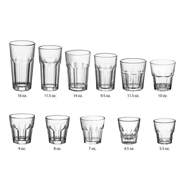 A row of Acopa Memphis cooler glasses with measurements on a clear glass.